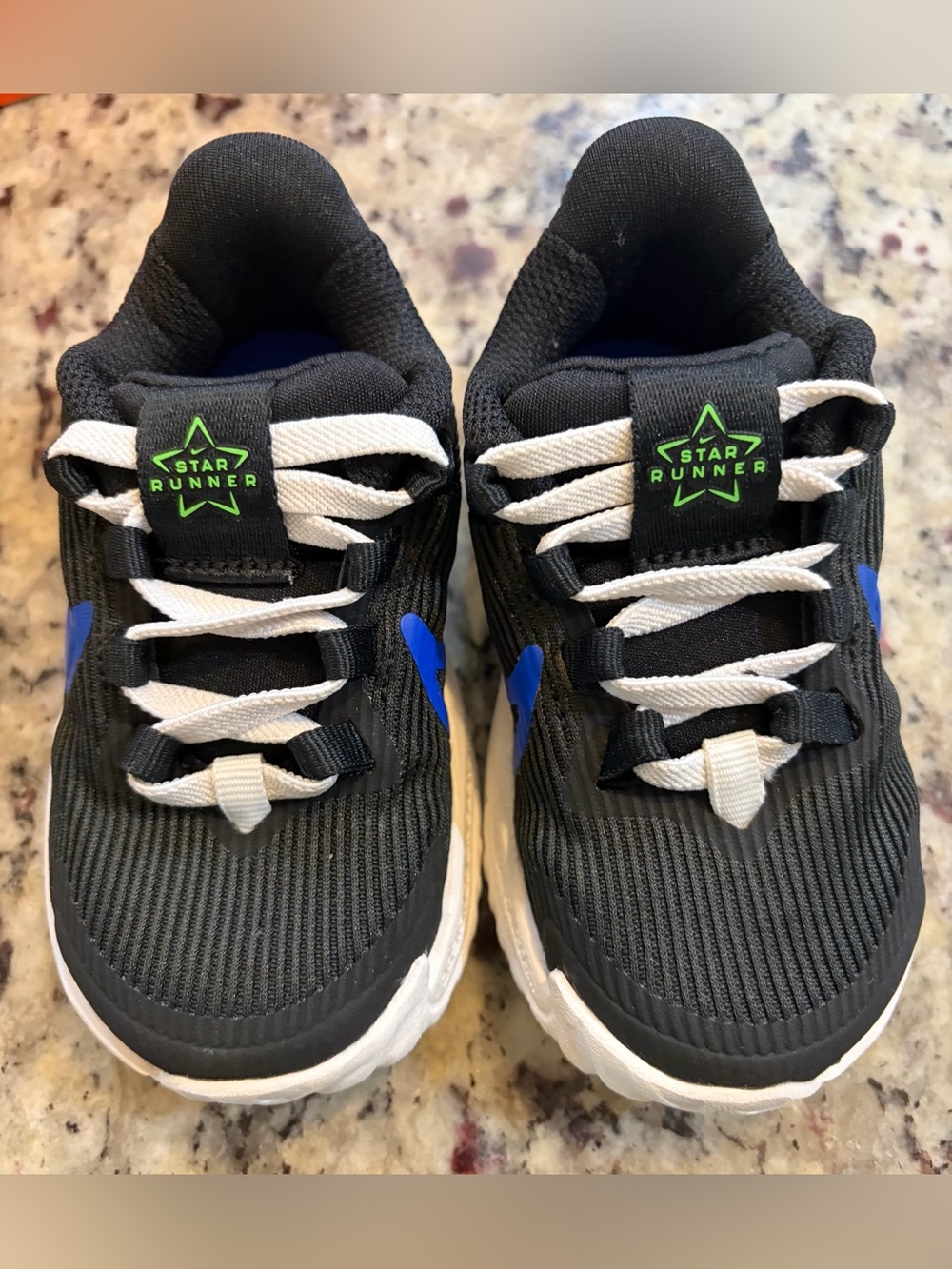 Nike Kids Black Sneakers with Blue Swoosh and White Laces